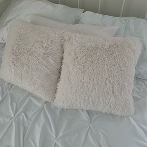 Fluffy white throw pillows
